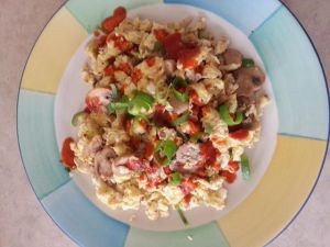 Basic scramble with mushroom, garnished with green onion and jalapeno pepper sauce.